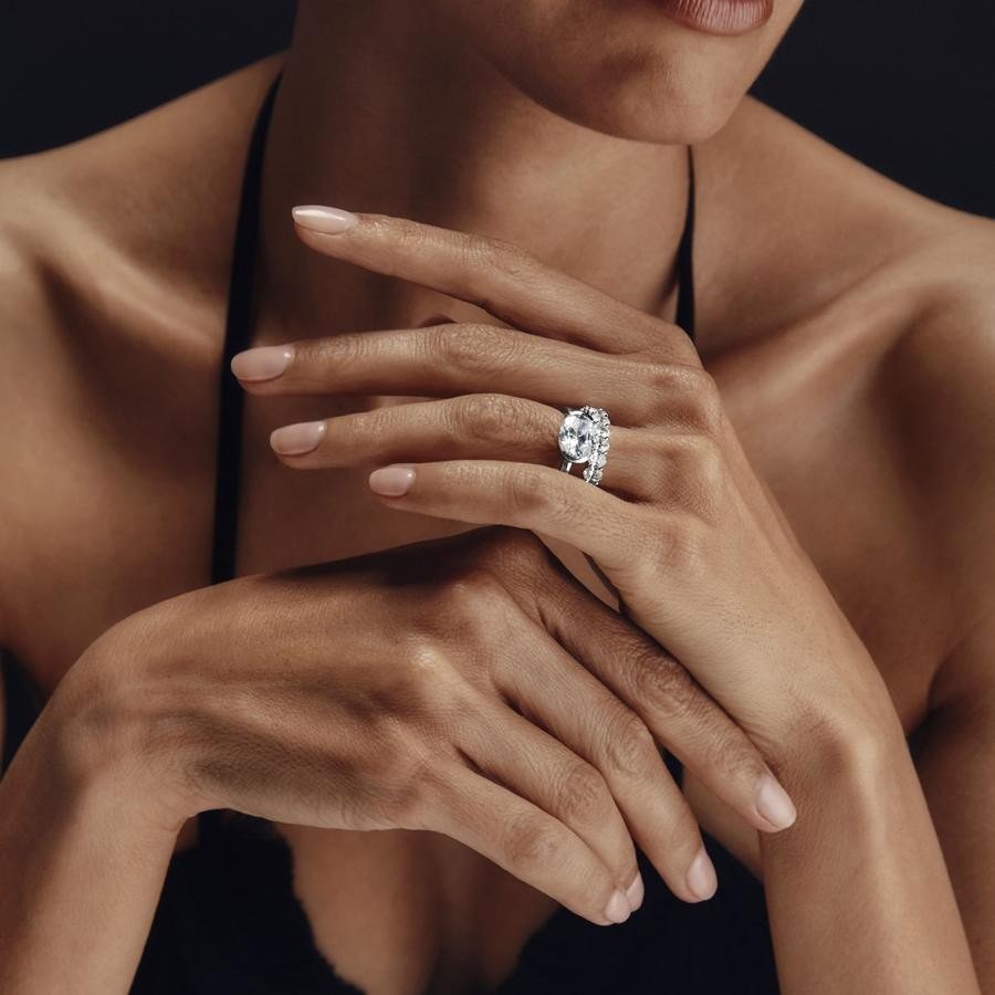 Engagement ring stacked with a wedding band, worn
