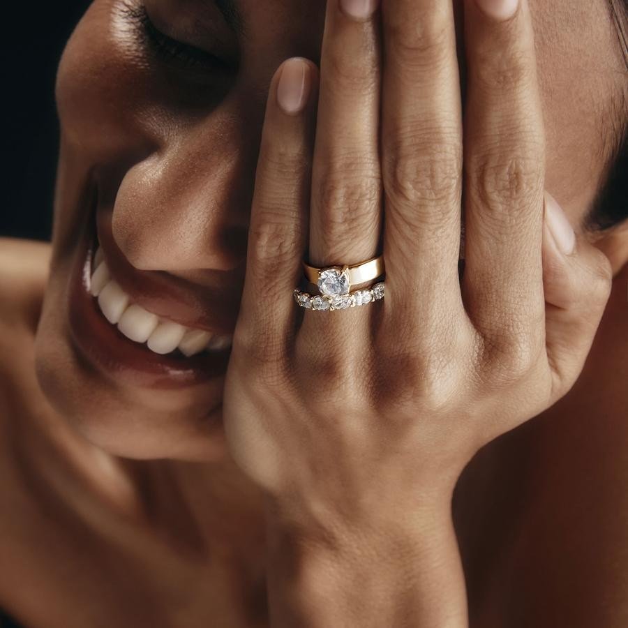 TenSevenSeven engagement ring and band, worn